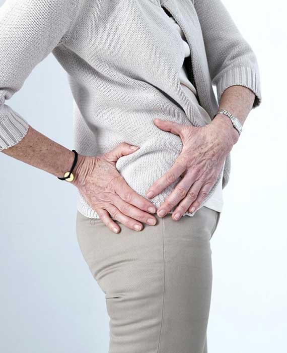 elderly woman holding hip